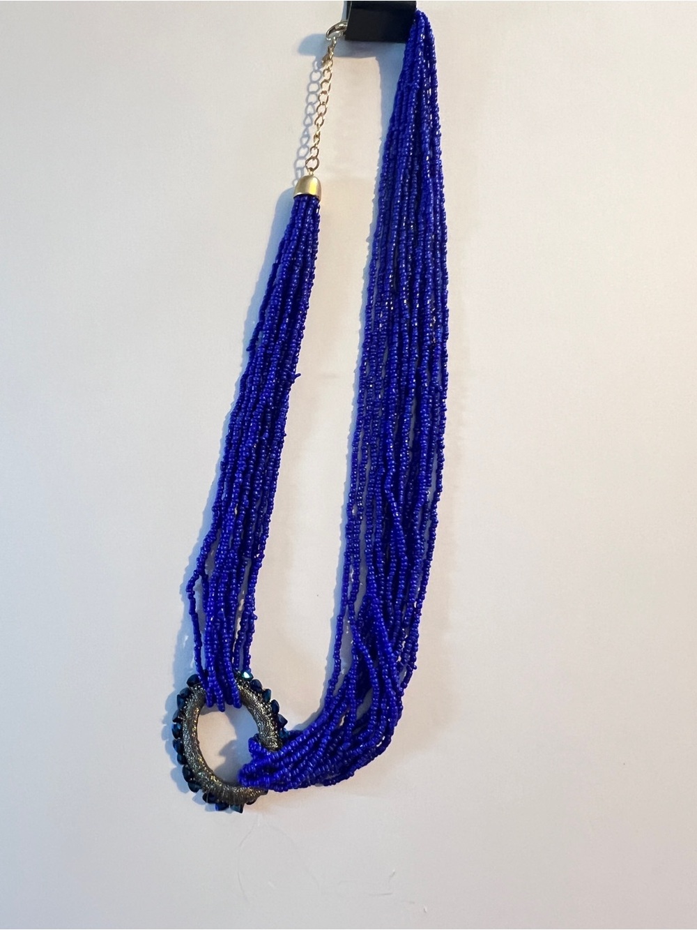 24” Purple Multi Strand Seed Beaded Necklace w/Oval Pendant Blue Crystal Stones